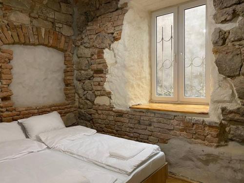 Ένα ή περισσότερα κρεβάτια σε δωμάτιο στο Багатомісні Апартаменти на Арсенальній