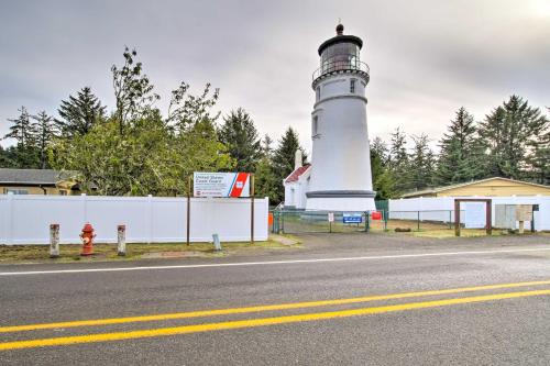 a lighthouse sitting on the side of a road at Winchester Bay Apt Near Dunes and State Parks! in Reedsport