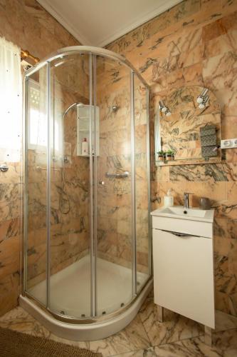 a bathroom with a shower and a sink at TMO Residence 2 in Ponta Delgada