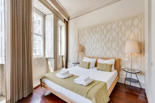 Postel nebo postele na pokoji v ubytování Traça Apartments by DA'HOME