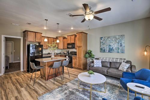 a living room with a couch and a table at Ideally Located and Elegant Condo with Balcony! in Tallahassee