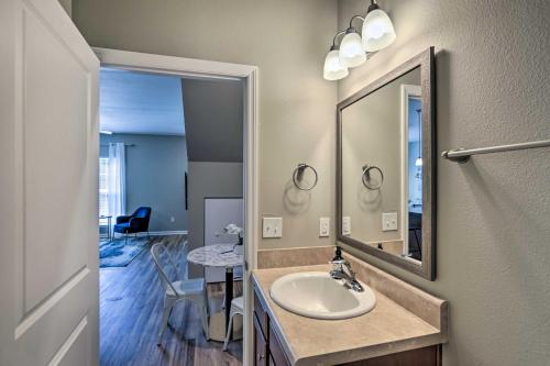a bathroom with a sink and a mirror at Ideally Located and Elegant Condo with Balcony! in Tallahassee