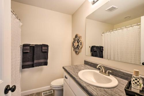 a bathroom with a sink and a mirror at Family-Friendly Greer Home with Balcony and Yard! in Greer