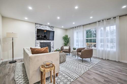 a living room with a couch and a fireplace at Community Beach and Lake Pocono Summit Escape in Pocono Summit