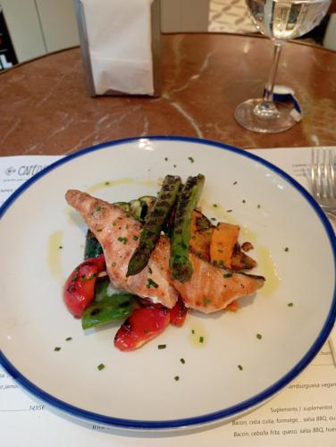 a plate of food with fish and vegetables on a table at Moderno in Barcelona