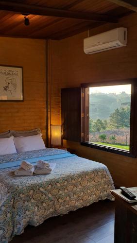 Una cama o camas en una habitación de Loft no campo próximo ao Vale dos Vinhedos