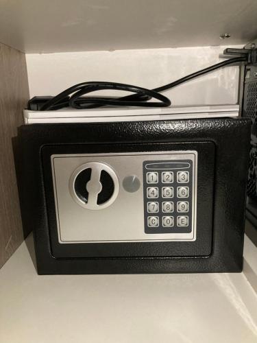 a toaster oven with a cord plugged into it at Ivkovic spa Milmari N16 in Kopaonik