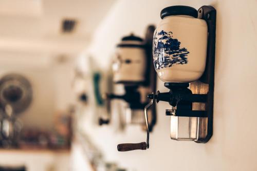 a row of lights hanging on a wall at Aktivhotel Wildschütz in Gmunden