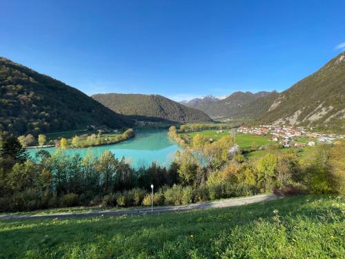 a view of a river in a valley with mountains at Apartment & Studio Forest Paradise in Cerkno