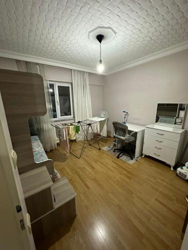 a living room with a bed and a desk at lovely 2 bedrooms apartment with full furniture in Beylikduzu