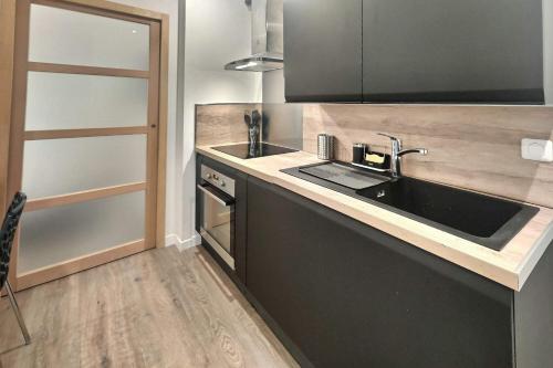 Η κουζίνα ή μικρή κουζίνα στο Mignon, T1 Bis cosy & calme, Neuf, Parking, Balcon