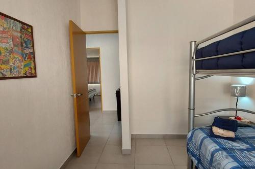 Ένα ή περισσότερα κρεβάτια σε δωμάτιο στο CIELITO LINDO casa de lujo con alberca 3 habitaciones