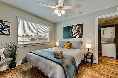 a bedroom with a bed and a ceiling fan at The Rhythm Room Near Downtown Dallas! in Dallas
