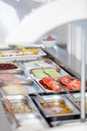 a buffet line with many different types of food at Theo Star Beach Hotel in Malia