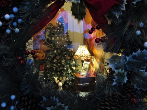 a christmas tree in a room with a lamp at Stratford House Exclusively for Adults in Llandudno