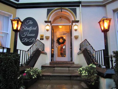 a front door of a hotel with a wreath on it at Stratford House Exclusively for Adults in Llandudno