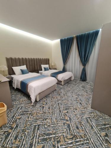 Ένα ή περισσότερα κρεβάτια σε δωμάτιο στο Amwaj Alula أمواج