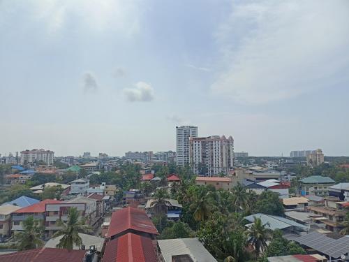 a view of a city with buildings and trees at Presidency Kochi City Centre in Cochin