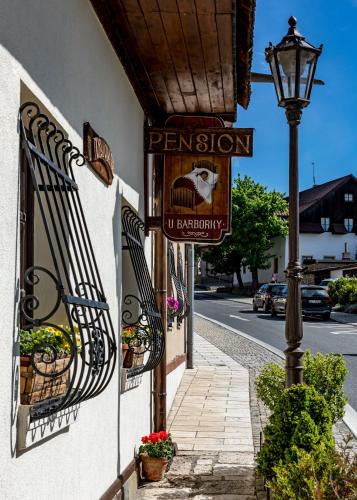 a street sign on the side of a building at Penzion Barborka in Poprad