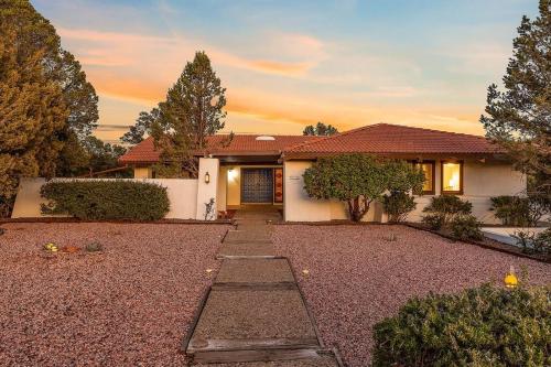 a house with a gravel driveway in front of it at Large Spanish Villa -Hot tub- Pool -Gym- Game Room in Sedona