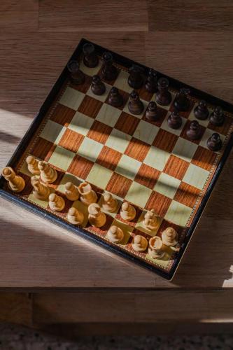 a chess board with donuts on it on a table at Hostal El Perelló, Valencia in El Perelló