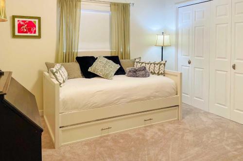 a bedroom with a bed with pillows on it at Lake Powell Views Mid-Century Home in Page in Page