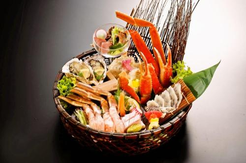 a basket full of vegetables and other foods at Kyukamura Hiruzen-Kogen in Maniwa