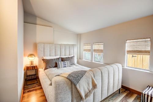 a bedroom with a large bed with a couch at Marble Falls Zen in Marble Falls