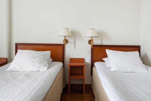 Katil atau katil-katil dalam bilik di Best Western Nya Star Hotel