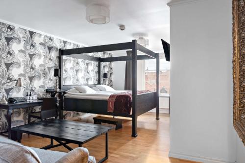 Postel nebo postele na pokoji v ubytování Donners Hotell