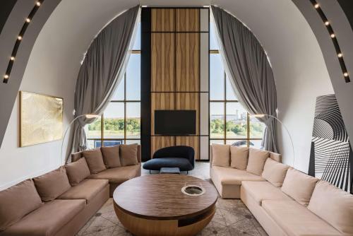 a living room with a couch and a table at Radisson Blu Hotel Rostov-on-Don in Rostov on Don