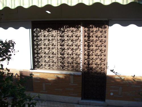 a door to a building with a design on it at B&B Rome For You in Rome