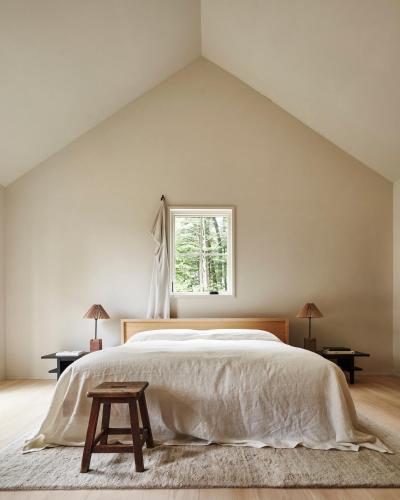a bedroom with a large bed and a window at Inness in Accord