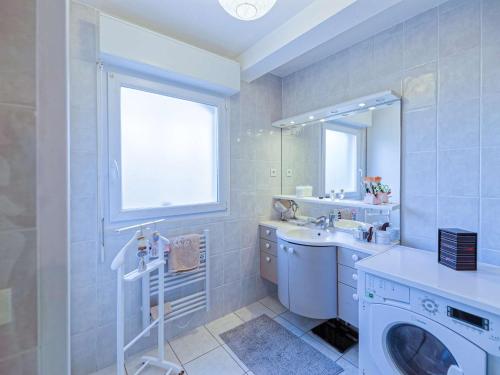 a bathroom with a sink and a washing machine at Appartement Bayonne, 2 pièces, 2 personnes - FR-1-3-538 in Bayonne