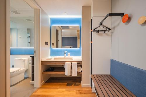 a bathroom with a sink and a mirror at Holiday Inn Express Taiyuan High Tech Zone, an IHG Hotel in Taiyuan