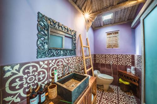 a bathroom with a sink and a toilet at Villa West - Charming 2 bdr villa in Oberoi - PERFECT LOCATION! in Seminyak