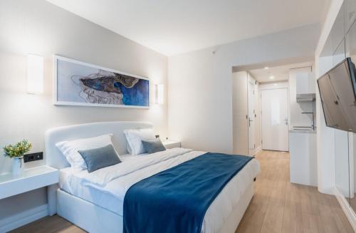 En eller flere senger på et rom på Batumi Inn Aparthotel With Sea View