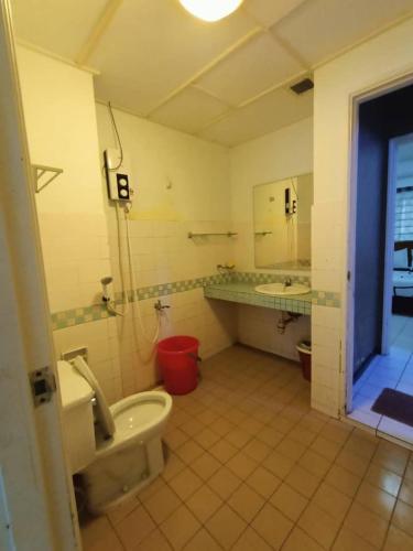 a bathroom with a toilet and a sink and a tub at Port Dickson Seaview Homestay in Port Dickson