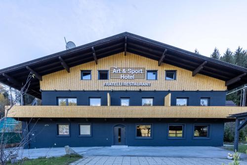 a building with a sign on the side of it at The Art and Sporthotel in Innsbruck