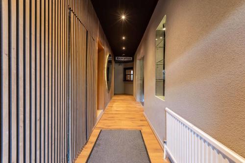 a hallway with a rug on the floor of a building at The Art and Sporthotel in Innsbruck