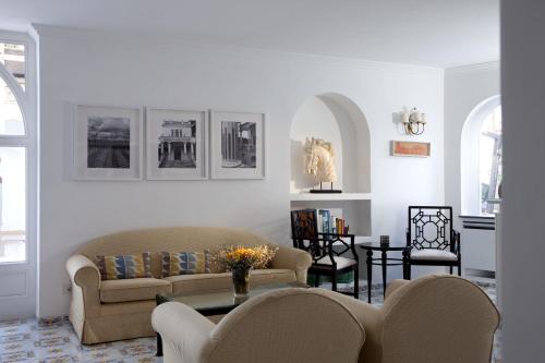 a living room with a couch and a table at Hotel Canasta in Capri