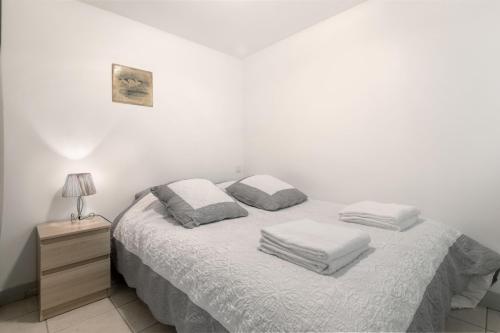 Posteľ alebo postele v izbe v ubytovaní CIVELLE Appartement proche Centre et Plages