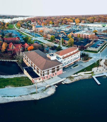 an aerial view of a city with a river and buildings at Nuk's Executive Suites in De Pere