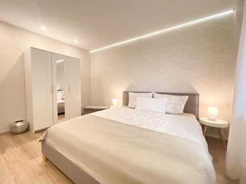 Katil atau katil-katil dalam bilik di Modernes Apartment in Zentrumsnähe mit eigenem Stellplatz