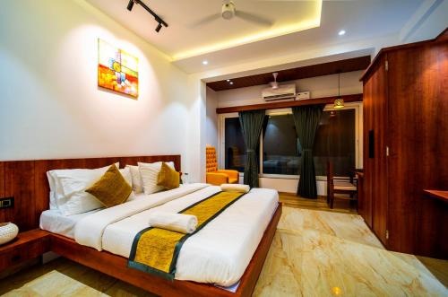a bedroom with a large bed in a room at CanvaSand By Eease Hospitality in Nagaon