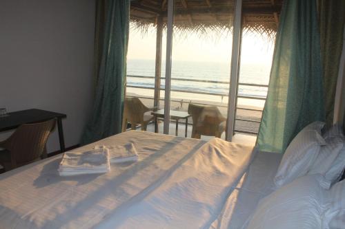 Postel nebo postele na pokoji v ubytování Agonda Beach Chalets