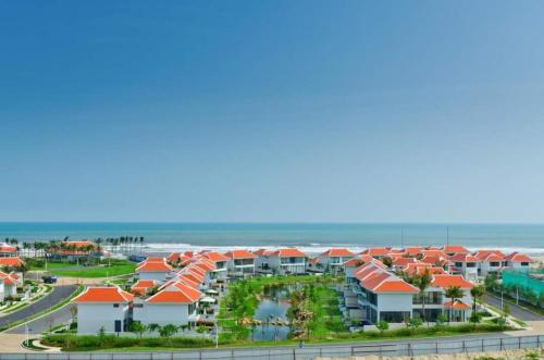 an aerial view of a resort with orange roofs at The Ocean Resort in Danang