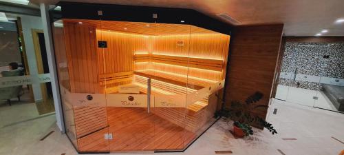 an empty elevator in a building with wooden floors at Paradise Hotel & Relax Center in Pomorie