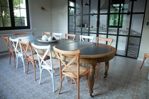 a dining room with a table and chairs at La Torre de Guardiola in Guardiola de Berguedà