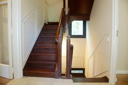 a winding staircase in a home with wood treads at La Torre de Guardiola in Guardiola de Berguedà